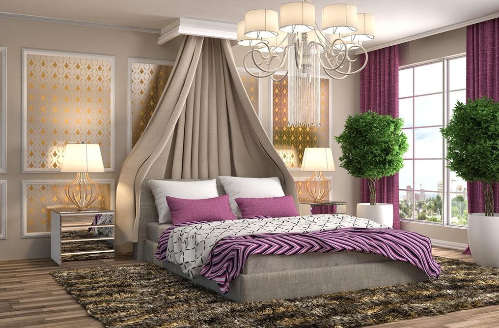 Luxury bedroom with canopy draping, chandelier, and purple accents